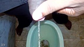 Boy Pees While Black Man Pisses in Urination Scene