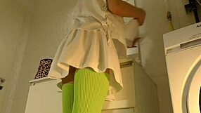 Sexy college brunette lifts mini skirt in bathroom flashing panties and socks