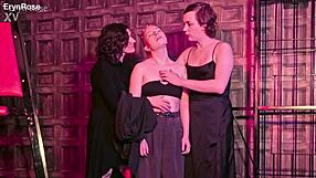 Chained succubus femdom licks submissive's shaved pussy in bondage cage