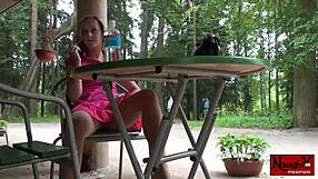 Hot babe teases upskirt views of panties and nylons underneath