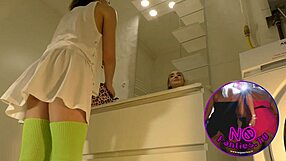 Sexy college brunette lifts mini skirt in bathroom flashing panties and socks