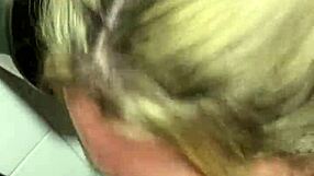 blonde slut deepthroats cock in public cinema bathroom