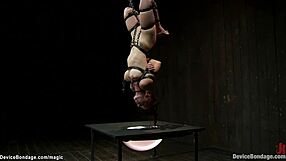 Redhead lesbian slave bound in latex lingerie gags on deepthroat toys while whipped