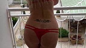 lisa flashes lingerie on balcony showing off tattoo