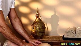 Blonde babe's tattooed hands stroke masseur during steamy massage session