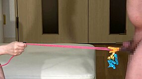 japanese mistress licks and whips slave's cock to erection control