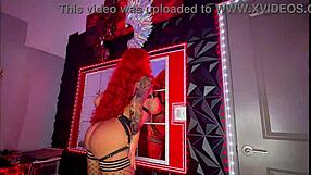 redhead's huge fake tits and fat ass burst out in oiled striptease