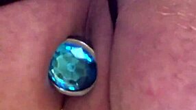 Sun692 Black Lingerie Teases Ass with Butt Plug Closeup