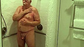 Grandpa strips naked flashes huge cock in sexy shower solo show