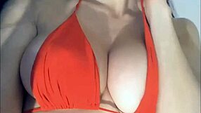 this hot young babe casually lifts her top teasing those big perky tits for the camera