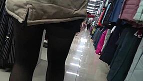 A hidden camera spies juicy PAWG ass and legs in fitting room nylon shorts
