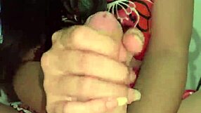 check out this brunette giving wellington prado a tasty handjob on his big cock in her pink outfit