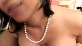 Brunette beauty in lingerie sucks big natural tits exposed