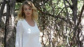 stunning blue-eyed blonde strips naked in forest flashing natural tits and narrow ass