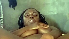 Sweet ebony teases pussy with dildo till she cums hard