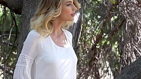 stunning blue-eyed blonde strips naked in forest flashing natural tits and narrow ass