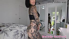 black red pink micro bikini clings to melody radford's huge tits in sexy gym try on!!