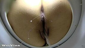 Anal Milk Enema Pisses from BBW Gaping Asshole in Public Toilet