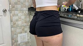 stepsis shorts pulled aside for sneaky ass cumshot while dishwashing