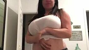 Homemade milf with big tits and tattoos strips teasingly at home for the camera