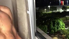 Naughty boy jerks off huge load at building window with handjob tease.