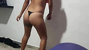 Sexy Latina shakes tattooed tits naked in hotel room