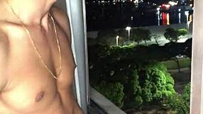 Naughty boy jerks off huge load at building window with handjob tease.