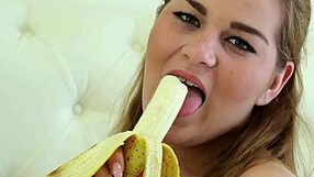 Erin bounces her huge natural tits while masturbating solo in bed.