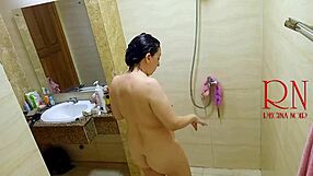 voyeur spies regina noir oiling juicy tits and pussy in shower