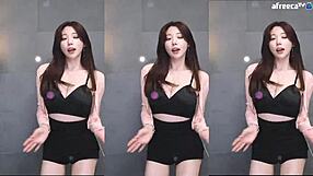 Korean babe shakes big tits while dancing sexy on her live stream!