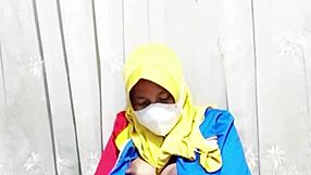 hijab girl from indomaret rubs hairy pussy with dildo before work shift