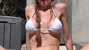 Oiled Bikini Tanning Leads to Vibrator Orgasm!