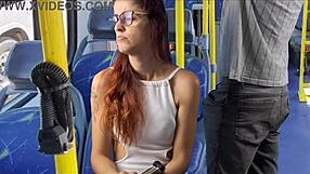 Skinny redhead flashes her shaved pussy on crowded bus
