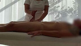 Asian babe oils caucasian cock for massive handjob cum explosion