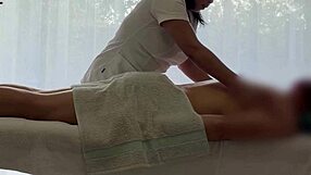 Asian babe oils caucasian cock for massive handjob cum explosion