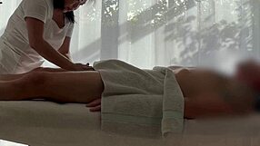 Asian babe oils caucasian cock for massive handjob cum explosion