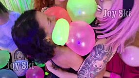 Curvy brazilian girls with tattoos kiss and rub balloons in steamy lesbian party fetish