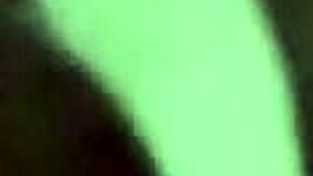 Latina masturbates with dildo closeup in bedroom.
