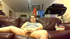 Chubby girl pisses pants while glued to TV screen