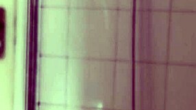 Big dick male carefully shaves his penis in the bathroom