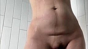 milf rubs big clit and spreads wet pussy lips in steamy shower.