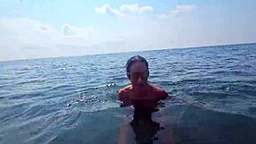 watching horny milf couple flash big natural tits on beach voyeur chat