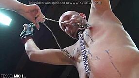 Slave endures nipple torture clamps wax then pissed on in toilet