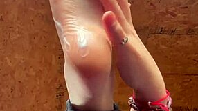 Girl Smoothly Applies Lotion to Her Soft Feet in Close-Up