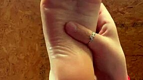 Girl Smoothly Applies Lotion to Her Soft Feet in Close-Up