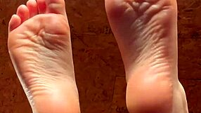 Girl Smoothly Applies Lotion to Her Soft Feet in Close-Up