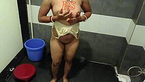 Desi Bhabhi Fingers Shaved Pussy in Steamy Bathroom Shower