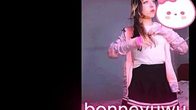 Bonneyuwu the cute petite Argentinian teen masturbates on bed in skirt