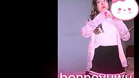 Bonneyuwu the cute petite Argentinian teen masturbates on bed in skirt