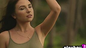 Petite brunette teen model poses naturally with big tits outdoors at photoshoot